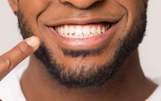 Experienced family dentist performing routine dental exam