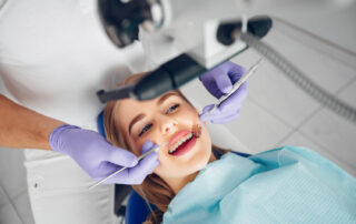 Cosmetic dentist discussing teeth whitening options with a patient